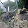 Prayer flags hanging outside the grain processing stalls in the village of sMu pa, in Kong po