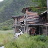 Stalls for processing grain at the edge of the village of sMu pa, in Kong po