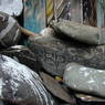 Stones piled at the side window of a temple in the village of sMu pa, in Kong po