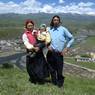 Tibetan&nbsp;family standing on a mountain over Lhagang town.&nbsp;