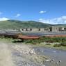Boats and bridge on river near Lhagang town.&nbsp;