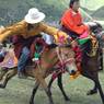 Tibetan men riding horses at Lhagang Hors Festival.&nbsp;