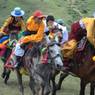 Young Tibetan boys riding horses.&nbsp;