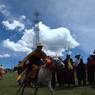 Tibetan man racing horse.&nbsp;