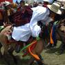Tibetan man racing horse in Lhagang horse festival