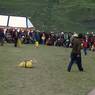 People competing in rock-throwing game at Lhagang Festival.