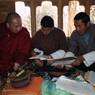 Dzongkhag cultural officer drafting an agreement between the people and dratshang