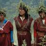 Beautiful ladies wearing shingka and chrysanthemum  hats joining their hands chanting Bro