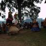 Gonpo and Gonmo dancing facing towards temple