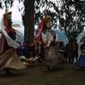 Lead master (chhampon) Gonpo and Gonmo dance in cirlce to the right of temple