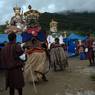 Gonpo Gonmo facing back to Guru statue and dancing