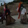 As dance of Gonpo and Gonmo moves people rushes for offering of the grains