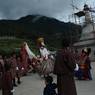 Gonpo, Gonmo and chhampon (lead master) dance around the Guru statue