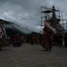 Chhampon (lead master) dancing facing audience while Gonpo Gonmo in line faces audience