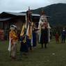 Nubchham dancers stand infront of temple