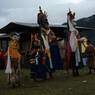 Nubchham dancers in line facing towards temple