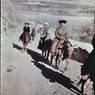 Officials ride up trail on the northeast side of Potala during New Year. Copyright Pitt Rivers Museum, University of Oxford 1998.157.92